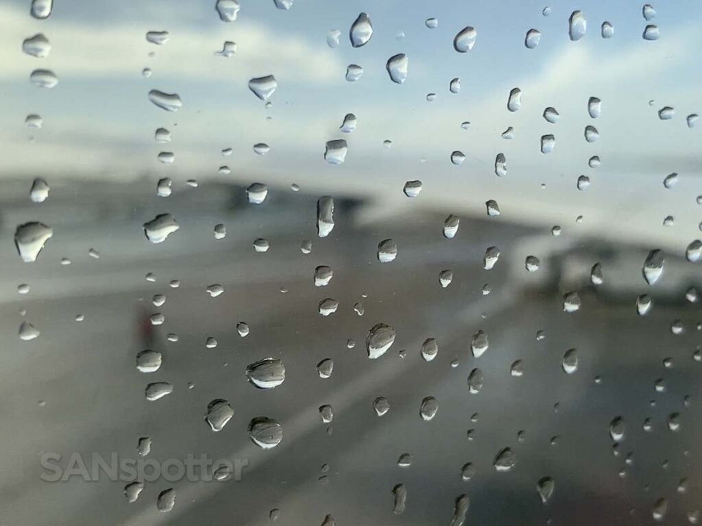 Raindrops on the window of a Boeing 787–9