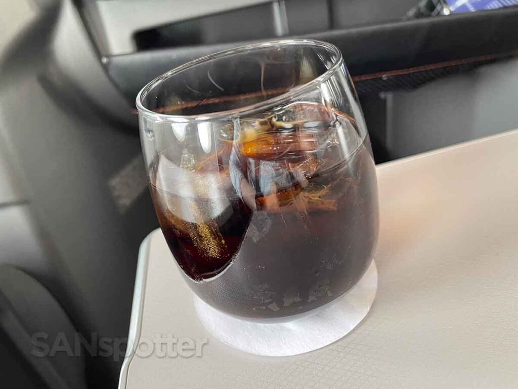 Coke Zero served in a glass with ice