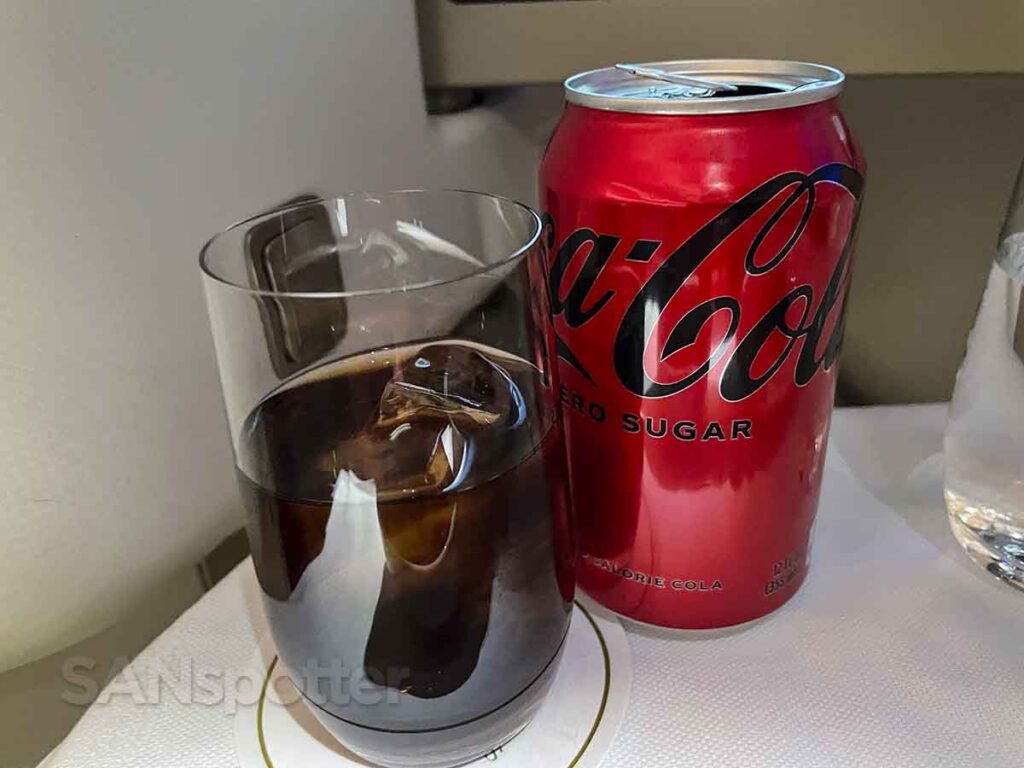 Coke zero served in a glass with ice