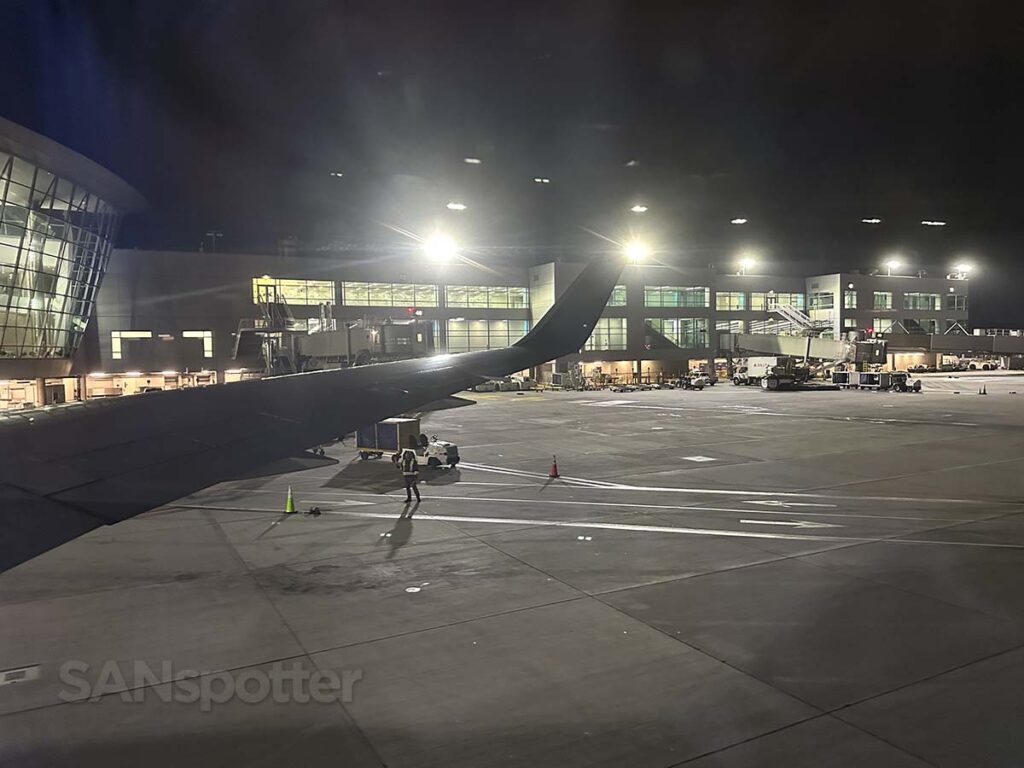 Delta 767-300 pulling up to the gate at SAN at night