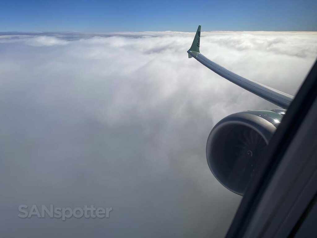 Flair Airlines 737 MAX 8 climbing above the clouds